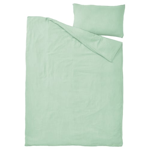 A light green SCHERSMIN duvet cover and pillowcase set. Made of 100% organic cotton, featuring a soft, wavy muslin texture.