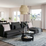 Stylish living room with SÖDERHAMN dark grey fabric sofa, white pillows, and modern decor.