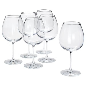 Six clear, crystalline wine glasses with long stems and large bowls, symmetrical design, arranged in a group.
