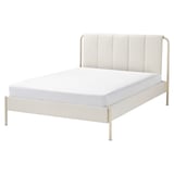 Modern white bed with striped headboard, gold legs, sleek design.