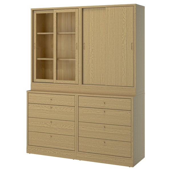 This image a light wood storage set with drawers and glass cabinet doors.