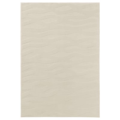 VÄXELFEL rug: light beige, soft polyester, rectangular, wavy 3d pattern.
