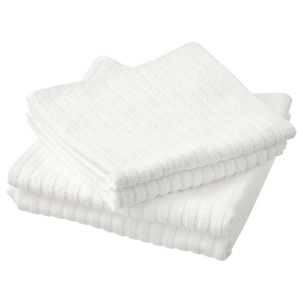 Stack of 4 white cotton towels. Soft, absorbent with ribbed texture. Part of VÅGSJÖN set.