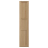 A tall, rectangular wooden door in natural oak with three rectangular panels. It a classic, simple design with a solid oak frame and veneer panelling.