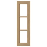 A VEDHAMN oak kitchen cabinet door with a natural wood frame and glass panels. Rectangular, solid oak edges, and a flat design.