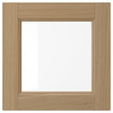 This image VEDHAMN wooden kitchen cabinet doors with a natural oak finish, fitted with glass panels; showcasing a simple, elegant, and durable design.