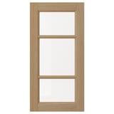 A VEDHAMN natural wood cabinet door with glass panels, featuring oak frames and a rectangular design.