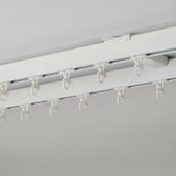 White ceiling-mounted curtain rod with several hooks, part of the VIDGA system for smooth gliding curtains.