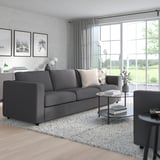 Modern living room: grey VIMLE sofa, large windows, light decor.
