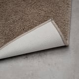 BACKMÅRA Bath mat, beige round, 55 cm