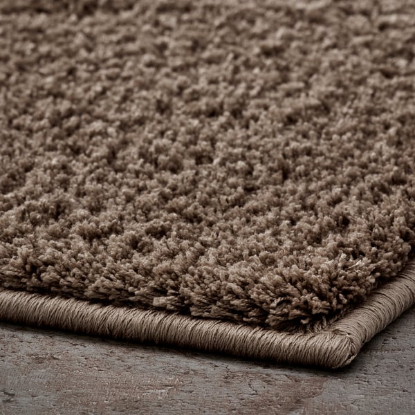 BACKMÅRA Bath mat, beige round, 55 cm