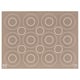 Brown ikea BAKTRADITION silicone baking mat with large white circle cutouts for even baking.