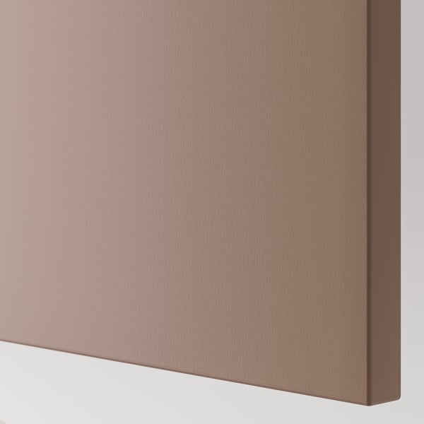 Close-up of a sleek, smooth, light brown wooden panel, likely from a cabinet or drawer, showing fine grain texture and quality craftsmanship.