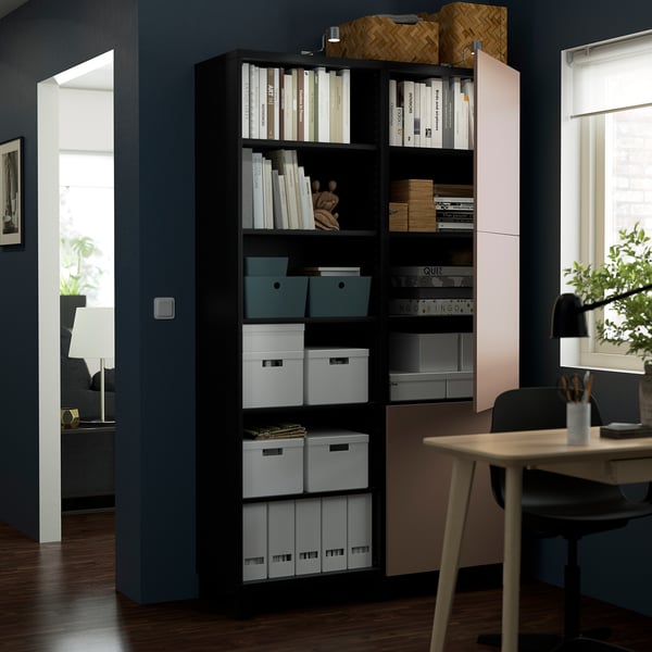 Bookshelf with adjustable shelves and doors, showcasing organised books, files, and storage boxes. Includes both open and closed storage compartments.
