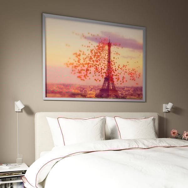Large BJÖRKSTA eiffel tower art above bed