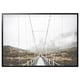 Sleek black-framed canvas bridge photo, modern minimalist design, surrounded by foggy mountains.