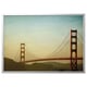 Is of the golden gate bridge in san francisco with light clouds.
