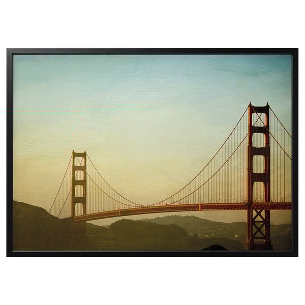 BJÖRKSTA: golden gate bridge photo. Red bridge, blue sky, green hills. Black recycled aluminium frame.