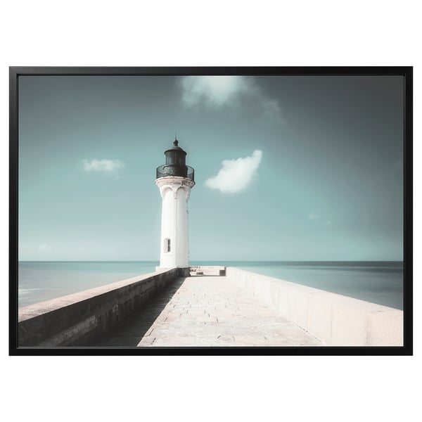 Bjorksta black-framed lighthouse canvas print. White lighthouse on clear blue ocean, calming coastal scene.