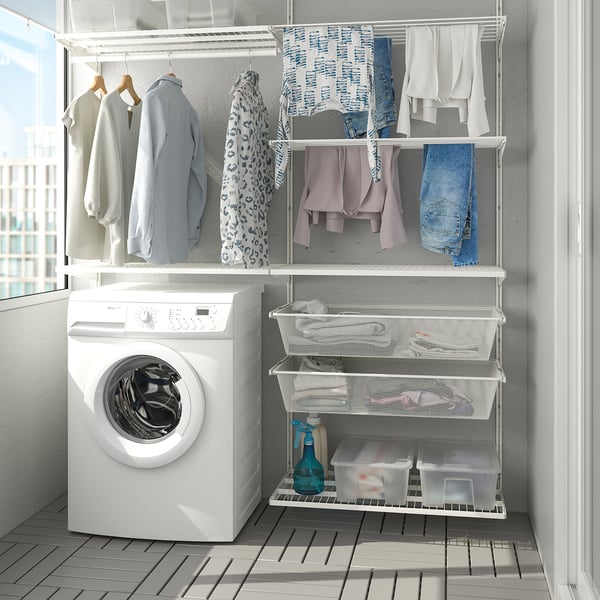 BOAXEL wall storage in laundry with drying rack and washing machine.