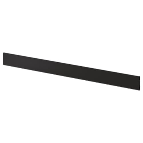 Black kitchen plinth, sleek and long, made of plastic and thermoplastic, completing cabinet base look.