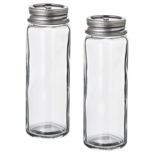 Two transparent glass jars with silver metallic lids, rectangular shape, simple design, for storing spices or other small items.