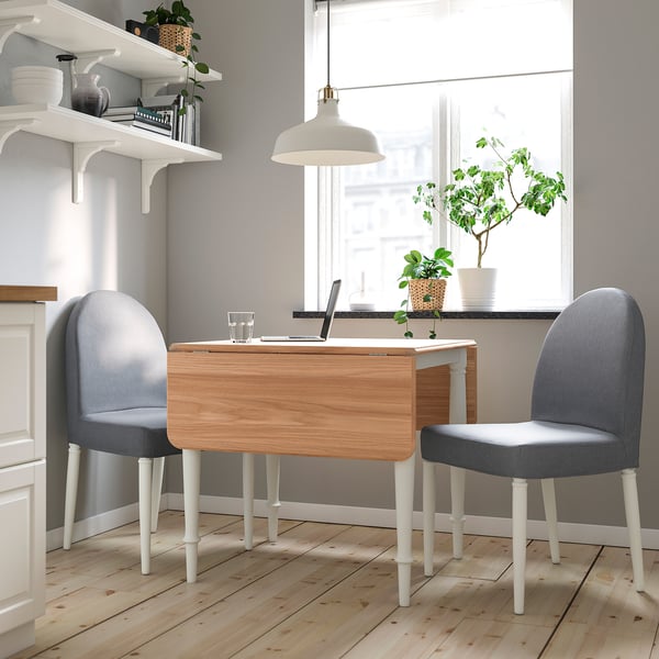 A compact DANDERYD dining set with a light wood table and grey chairs, perfect for small spaces.