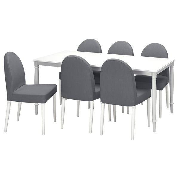 This image depicts a white DANDERYD dining table surrounded by six grey chairs. The table and chairs feature clean lines and modern designs.