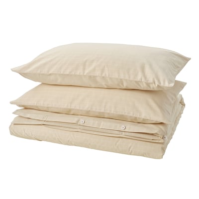 A neatly folded beige DOFTAKLEJA duvet cover set with chequered design, made of cotton.