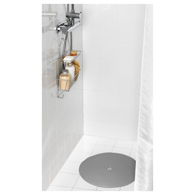 Shower mat with suction cups for secure placement, ensuring safety while bathing.