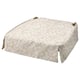Beige floral chair pad with skirt-like design, round shape, and cushioned comfort.