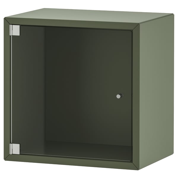 Depicts an olive green EKET storage cabinet with a glass door. Its a square shape with a modern design, featuring clean lines and minimalistic style.
