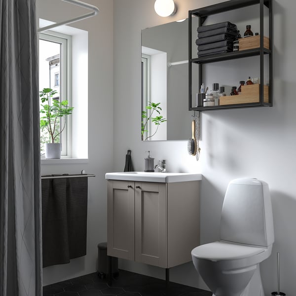 Modern grey bathroom with white sink, toilet, mirror, and towel rack. Mixes open and closed storage with a prominent mirror.