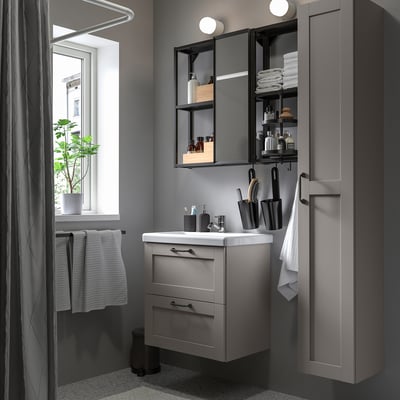 Modern grey ENHET bathroom with vanity, basin, tall cabinet, and mirrored storage.