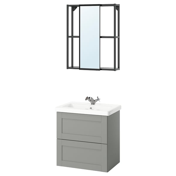 Modern bathroom setup featuring ENHET grey vanity with two drawers, a white ceramic sink, and a black-framed wall mirror with a sliding feature.