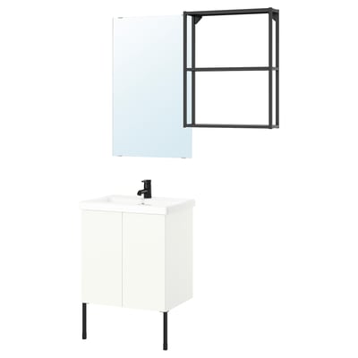 Modern white bathroom vanity with a black tap and mirror. Includes open shelving and black legs.