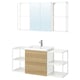 Displays an ENHET white and oak bathroom vanity with a sink, mirror cabinet, and open storage.