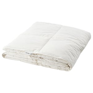 The FJÄLLARNIKA duvet in white, featuring stitched walls for warmth, filled with down and feathers, and made of cotton. Its folded neatly.