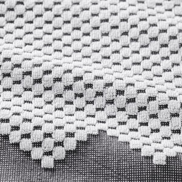 White hexagonal patterned bath towel.
