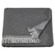 Dark grey, textured cotton towel with fringed edges; bohemian style.