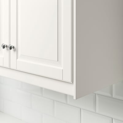 White cabinet with chrome knobs and FÖRBÄTTRA light.