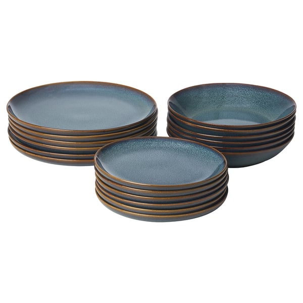 Three stacks of GLADELIG dinnerware, ocean-blue with golden-brown rims, in circular shapes, neatly displayed.