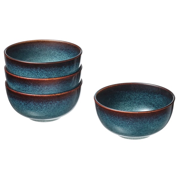 Four blue bowls with brown rims; three stacked, one separate. Crafted from stoneware with a glazed finish, perfect for serving.