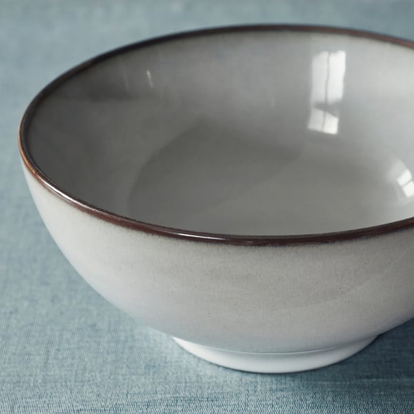 White bowl with grey glaze, smooth, for serving.