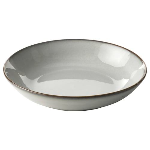 Rounded sandy glaze stoneware plate with slightly flared rim, handcrafted look.