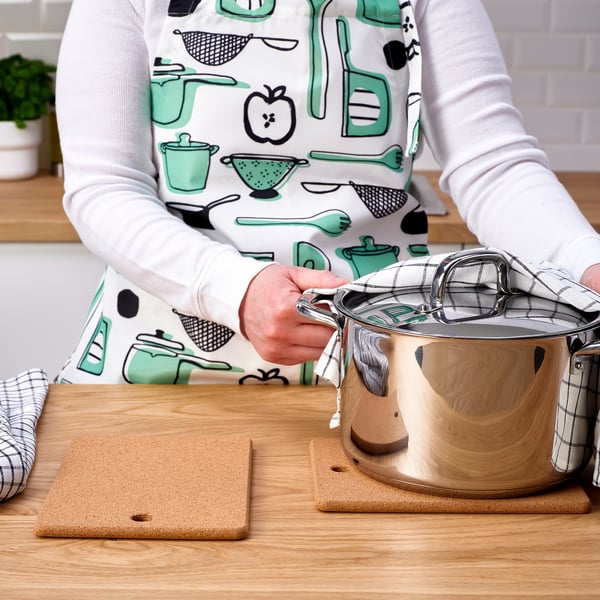 Cook lifting lid on counter