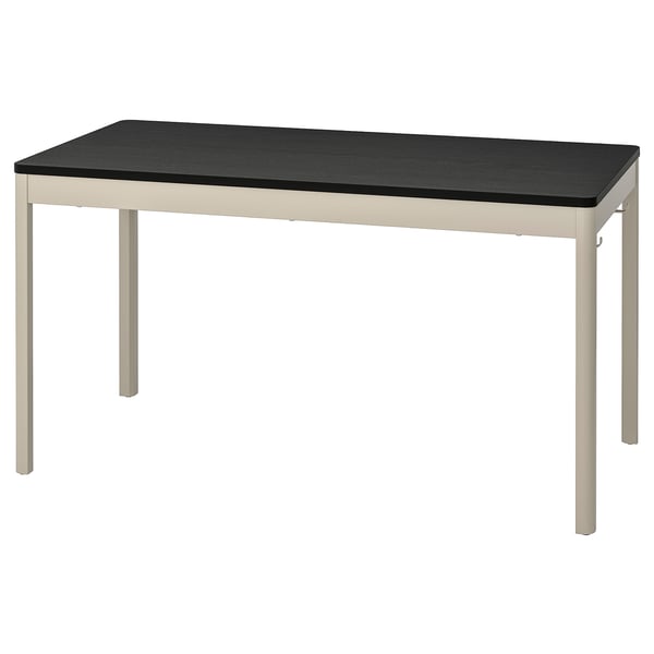 An IDÅSEN desk with a black top and beige legs, rectangular, modern style.