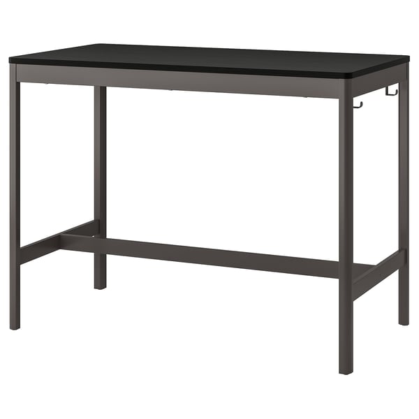 Black rectangular office table, IDÅSEN, steel legs, wooden top, minimalist design, adjustable height.