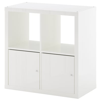 A white KALLAX storage unit with two compartments, one with doors. Modern and minimalist design for organising small spaces.