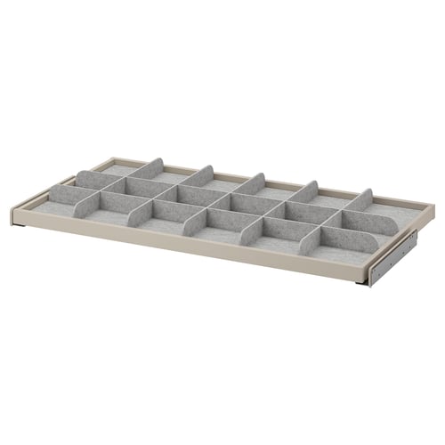 A white KOMPLEMENT drawer organiser with fabric dividers for tidy storage.